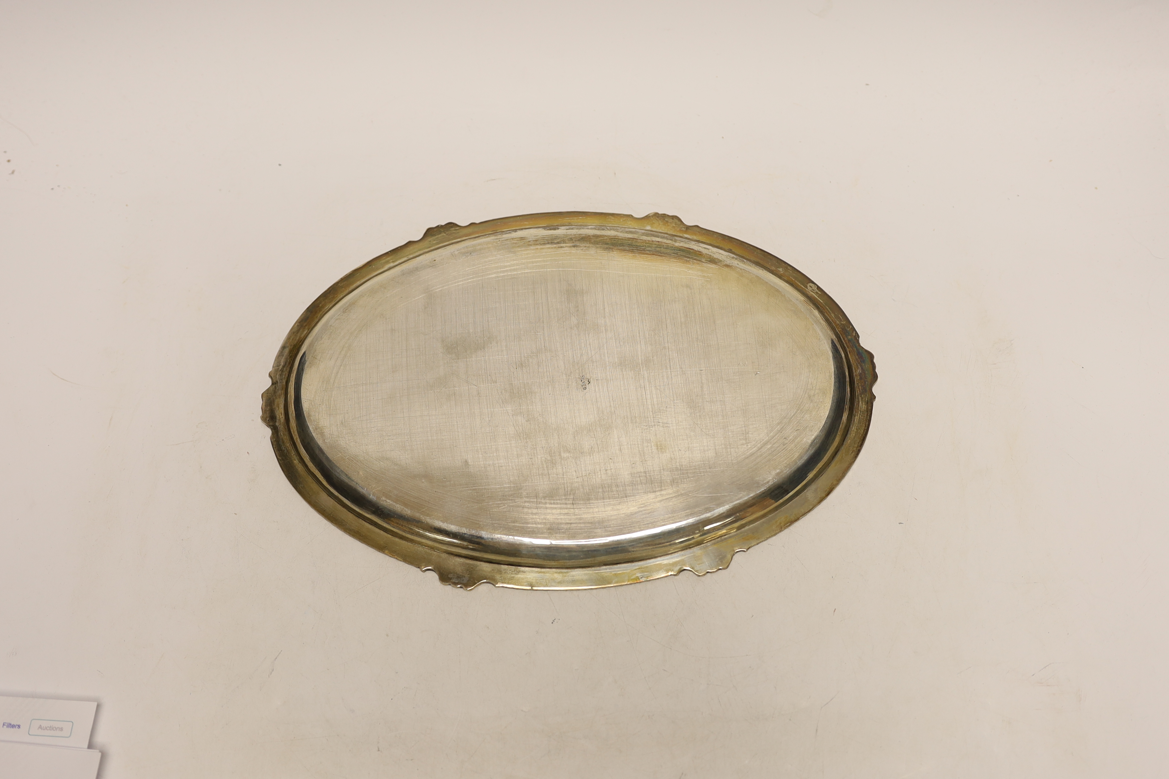 An Indian engraved white metal oval dish, 30.7cm, 10.9oz.